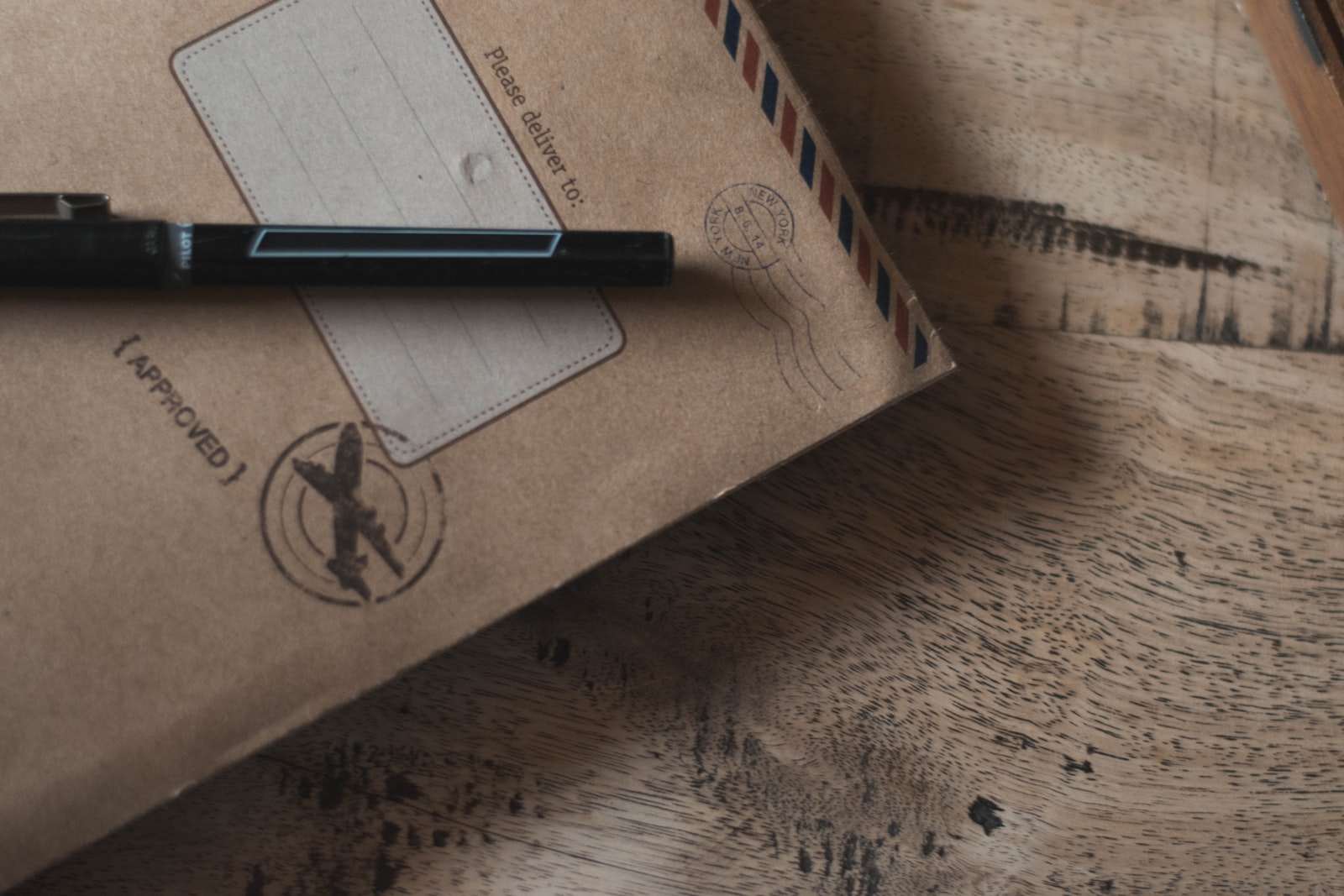 Photo by Trinity Treft closeup photo of black ballpoint pen on book