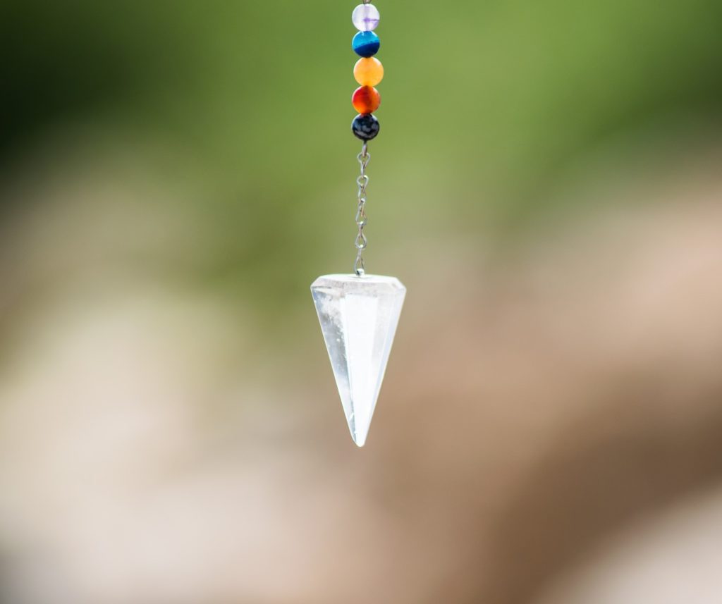 Photo by Frames For Your Heart silver diamond pendant with red blue and yellow beads